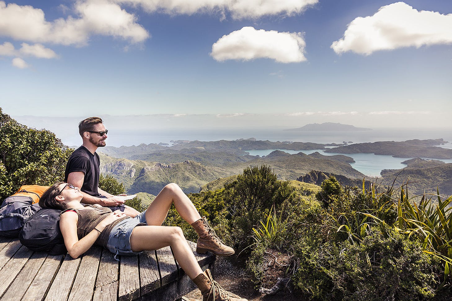 Two people taking a break on the Aotea Track, Great Barrier Island